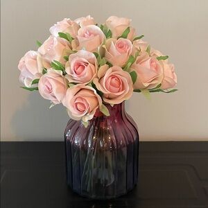 Pink Rose Arrangement in a pink and blue glass vase.